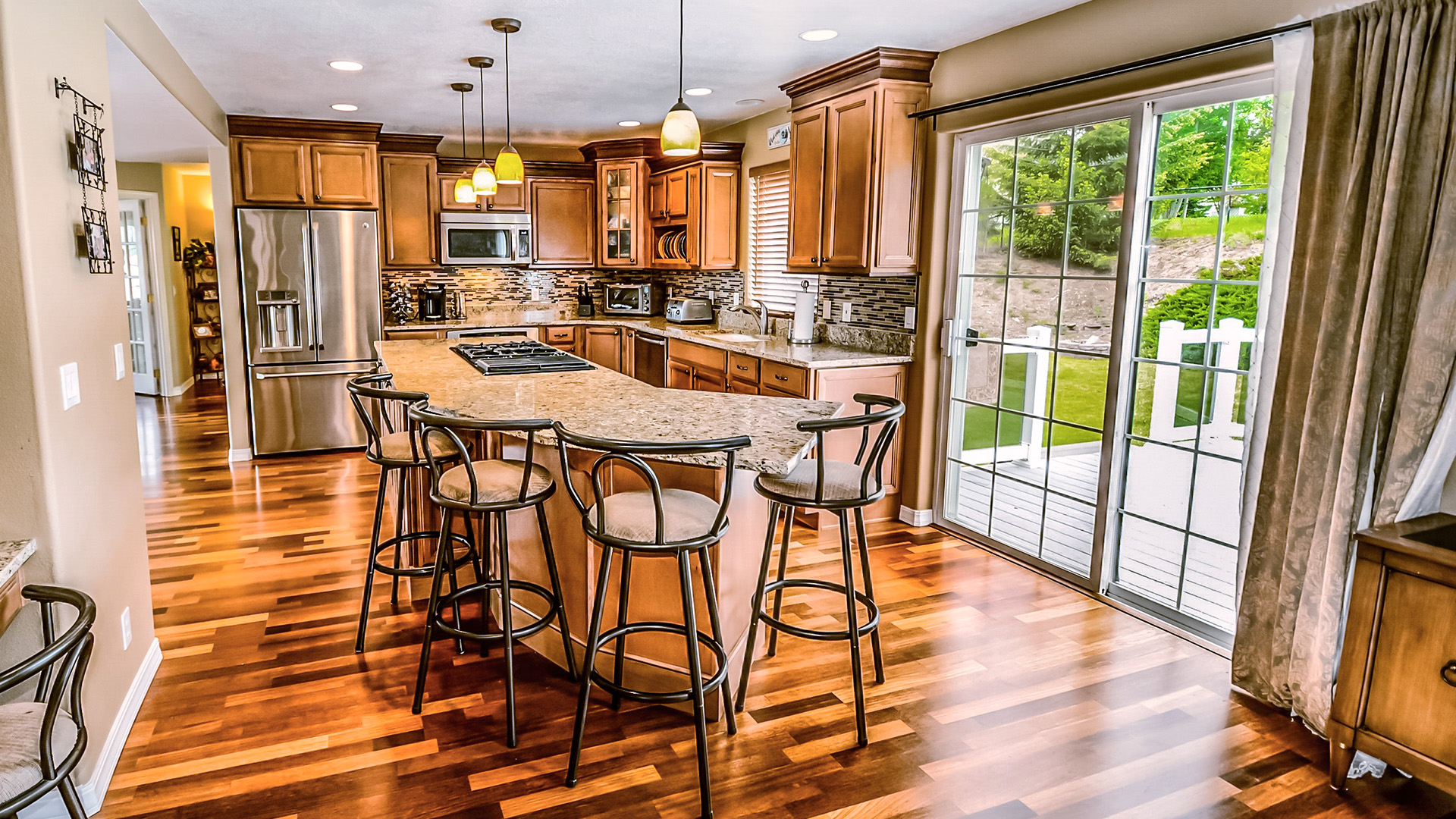 renovated kitchen with natural lighting and bar seating